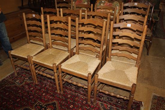 A set of twelve oak ladderback dining chairs,